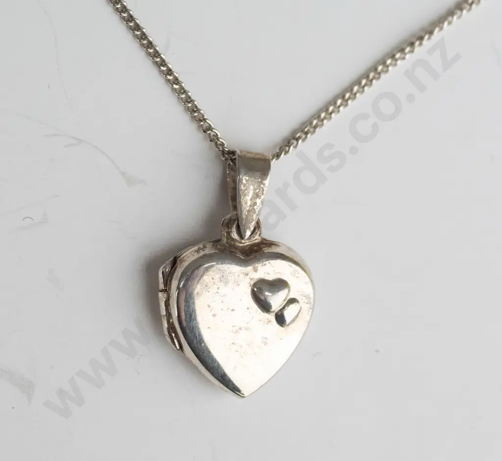 silver heart locket with 2 raised heart on front stamped 925 Image 1++