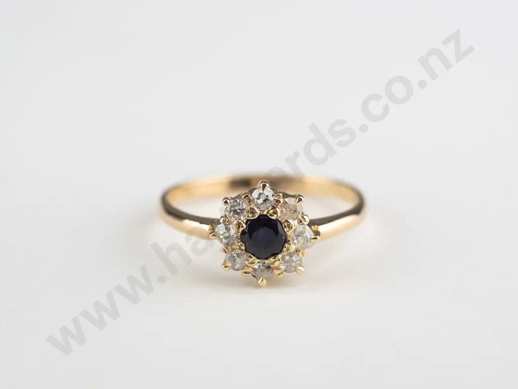 18ct sapphire & diamond cluster centre 3.00mm sapphire surrounded by 8 diamond approx .03 Image 1++