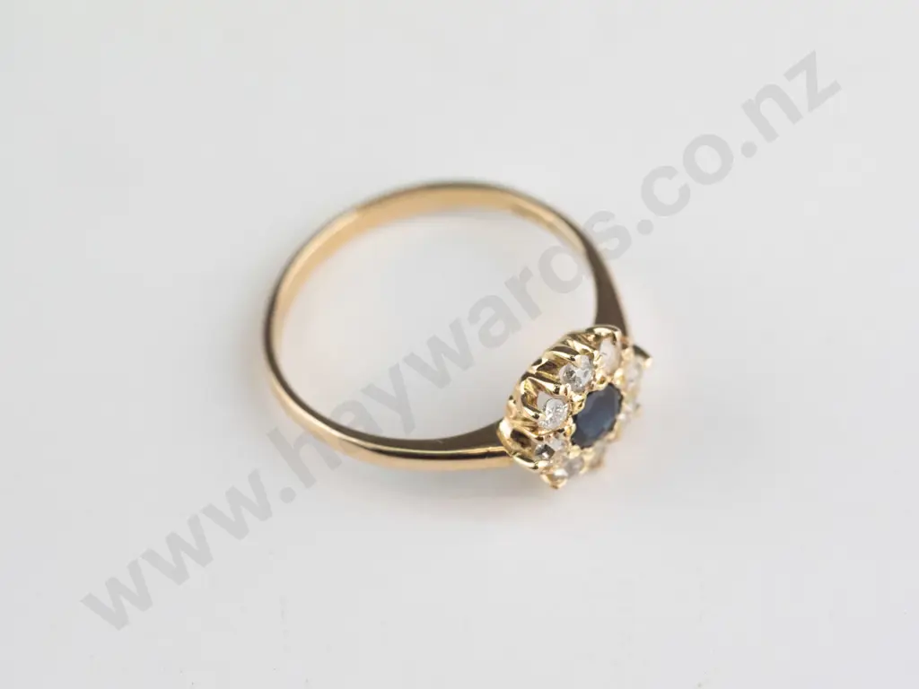 18ct sapphire & diamond cluster centre 3.00mm sapphire surrounded by 8 diamond approx .03 Image 1++