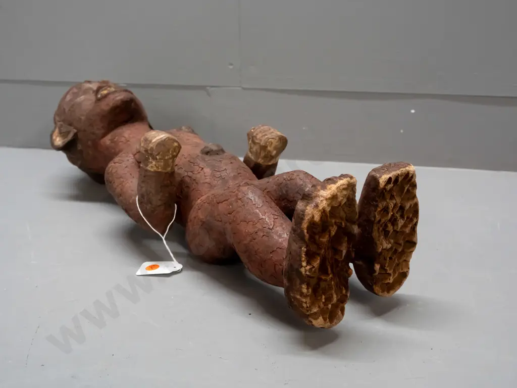 African carved wood standing figure, possibly Tanzania, coloured with earth pigments. Crack / repair to one arm, crazing Image 1++