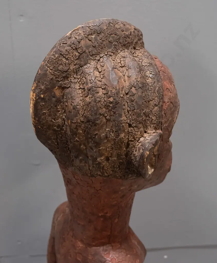 African carved wood standing figure, possibly Tanzania, coloured with earth pigments. Crack / repair to one arm, crazing Image 1++