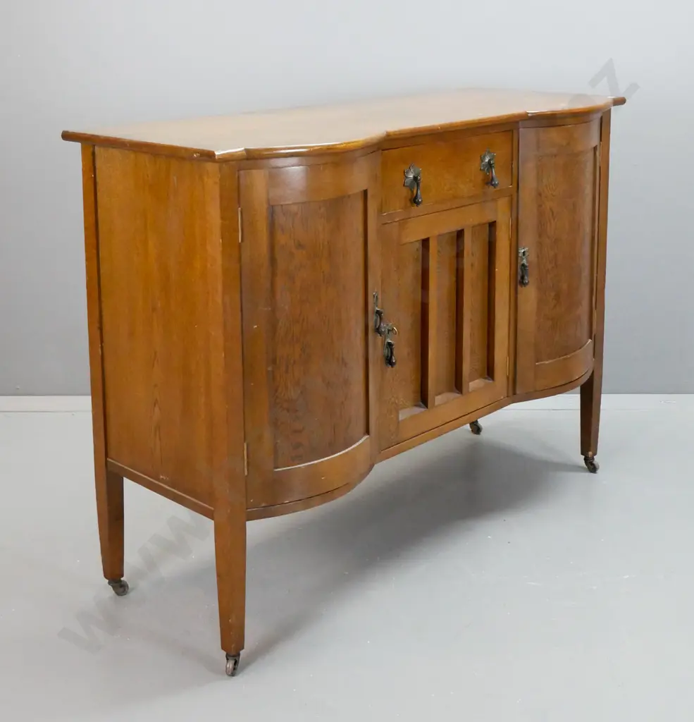 oak sideboard with 2 bowed cupboard doors, central drawer lined with felt, over cupboard door, metal drop handles, Image 1++