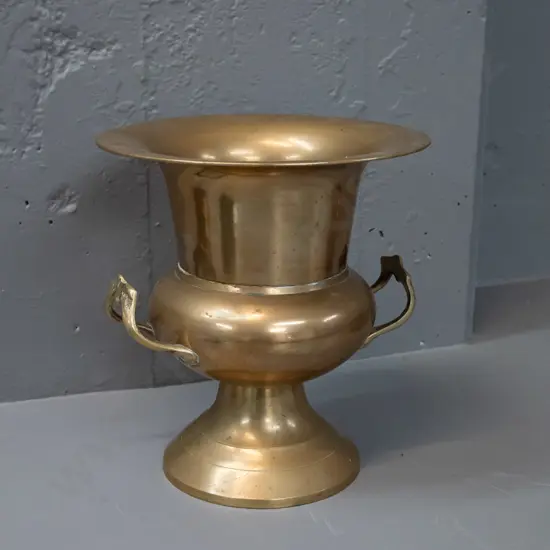 brass urn with cast handles - some discolouration and small dent in rim H-250 D-230