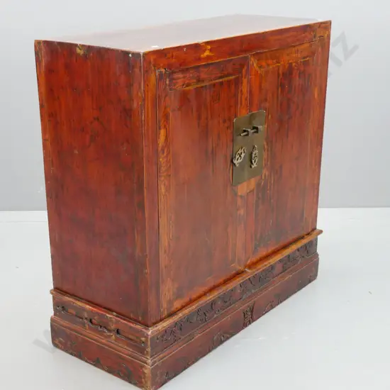 Chinese elm 2-door cupboard with blind-carved 2-step plinth base w/ character mark and foliate motifs, brass plates with