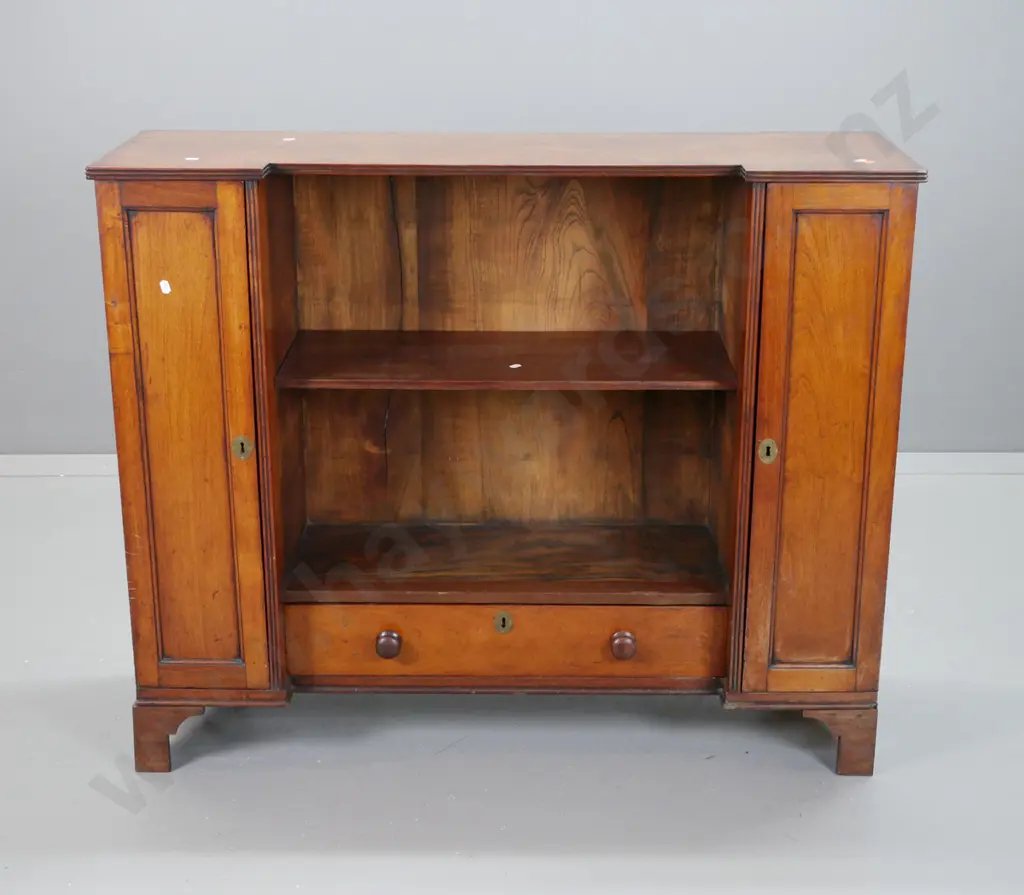 late Georgian mahogany inverted break-front bookcase w/ 2 panelled doors, inner shelves, central cavity w/ single shelf, Image 1++