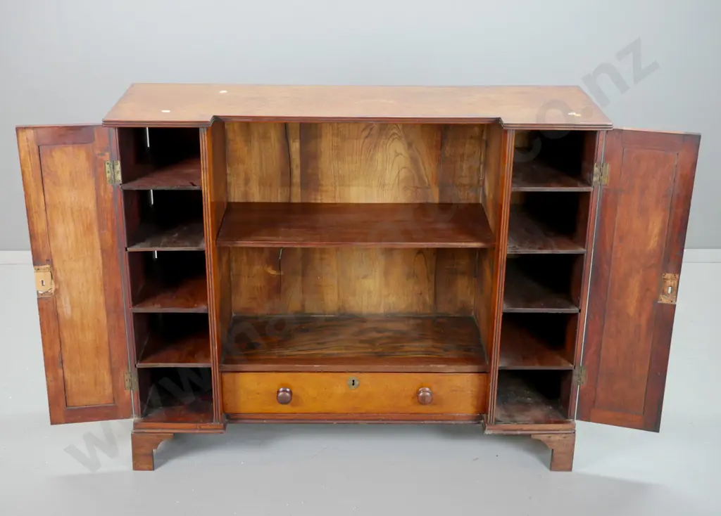 late Georgian mahogany inverted break-front bookcase w/ 2 panelled doors, inner shelves, central cavity w/ single shelf, Image 1++