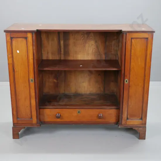 late Georgian mahogany inverted break-front bookcase w/ 2 panelled doors, inner shelves, central cavity w/ single shelf,