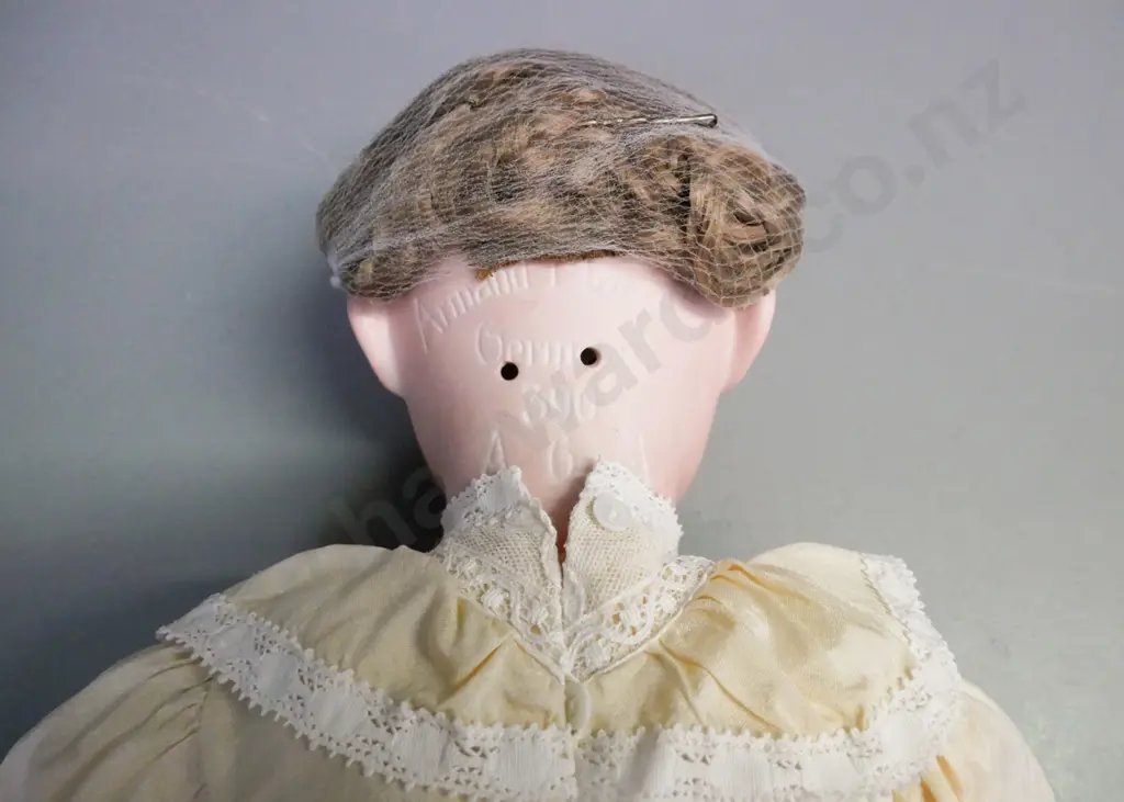 porcelain doll by Armand Marseille Germany, glass opening/closing eyes, signed on back of head. Image 1++