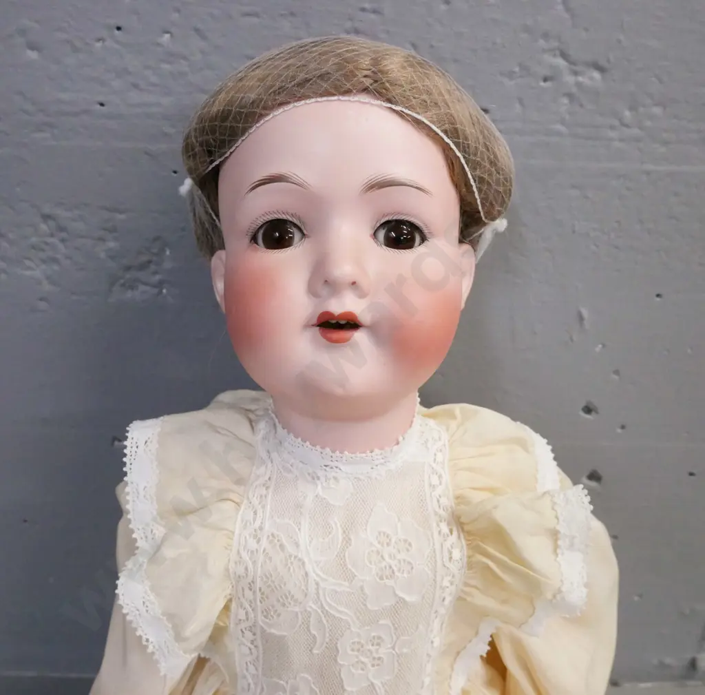 porcelain doll by Armand Marseille Germany, glass opening/closing eyes, signed on back of head. Image 1++