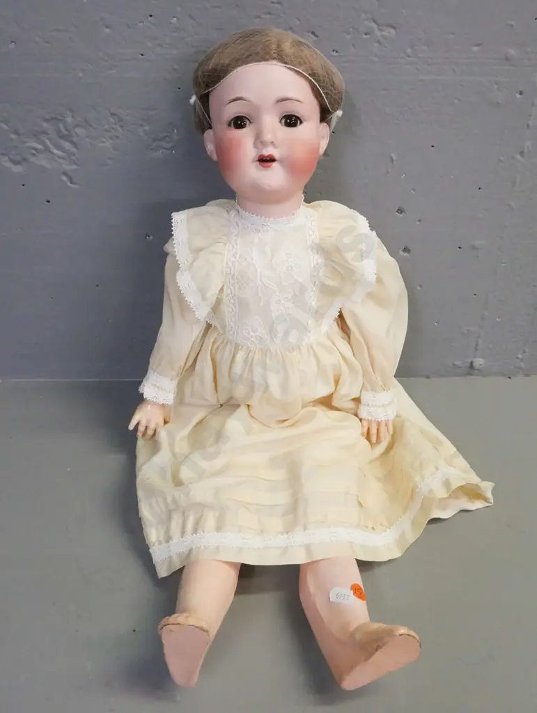porcelain doll by Armand Marseille Germany, glass opening/closing eyes, signed on back of head. Image 1++