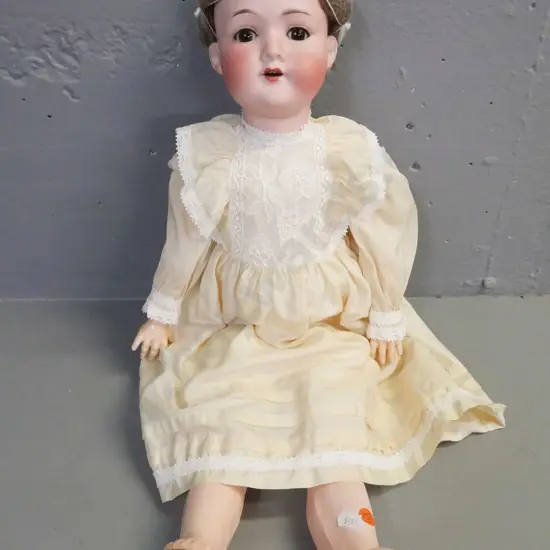 porcelain doll by Armand Marseille Germany, glass opening/closing eyes, signed on back of head.