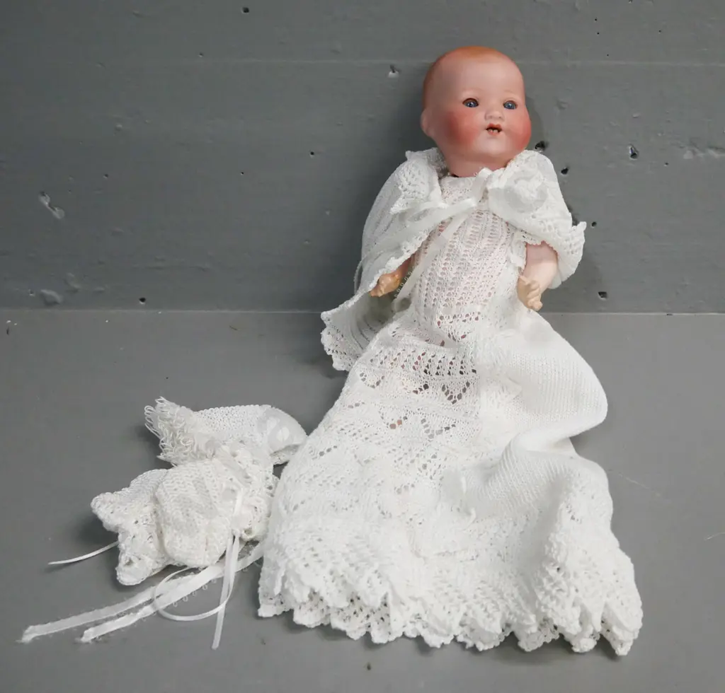 porcelain small sleeping doll by Armand Marseille Germany, blue glass opening/closing eyes, signed on back of head. Image 1++