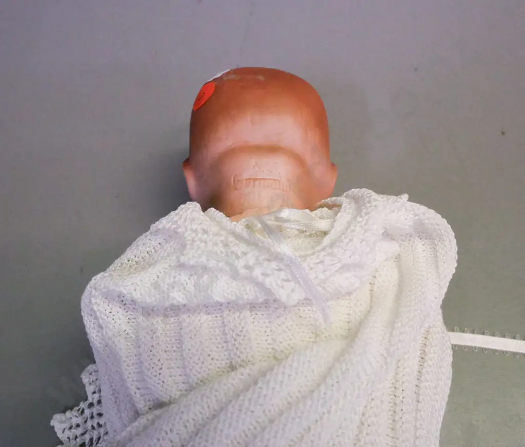 porcelain small sleeping doll by Armand Marseille Germany, blue glass opening/closing eyes, signed on back of head. Image 1++