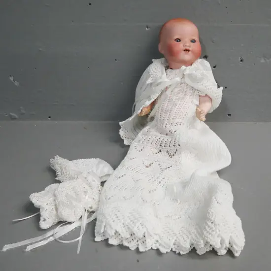 porcelain small sleeping doll by Armand Marseille Germany, blue glass opening/closing eyes, signed on back of head.