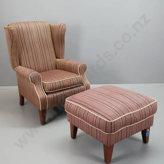 traditional style wingback rolled arm armchair with matching ottoman, woven rope edging on striped fabric upholstery.