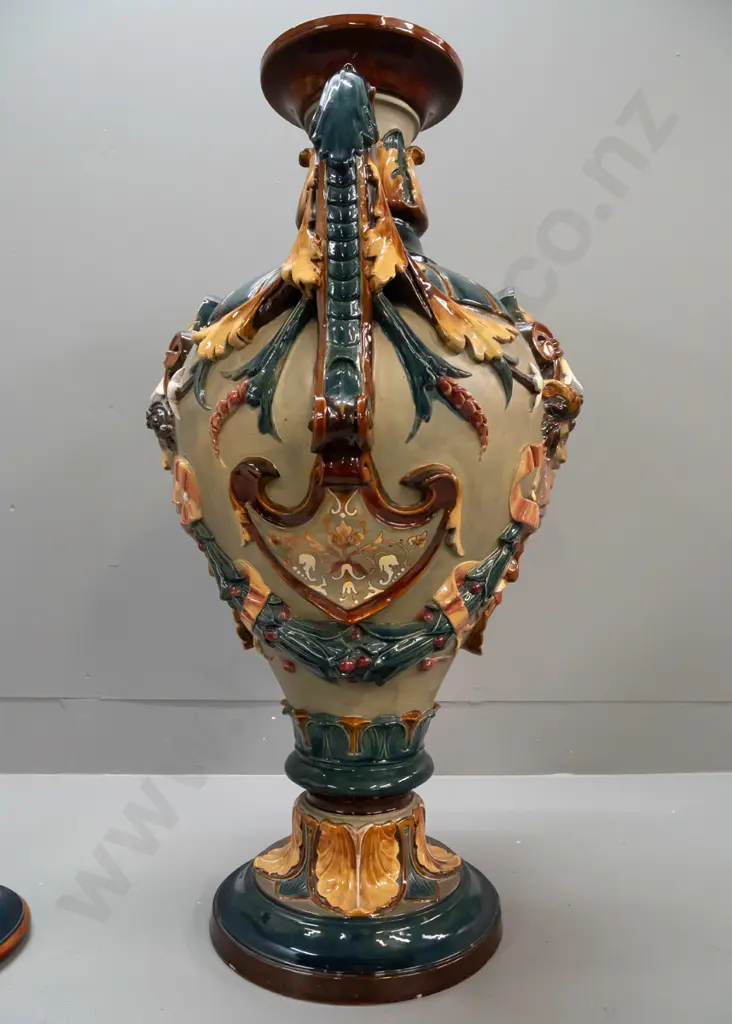 large Wilhelm Schiller & Sons Majolica lidded urn with foliate scrolling handles, acanthus leaf motifs, 2 heads, fluted Image 1++