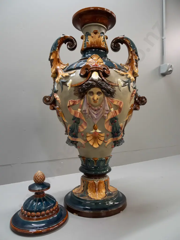 large Wilhelm Schiller & Sons Majolica lidded urn with foliate scrolling handles, acanthus leaf motifs, 2 heads, fluted Image 1++