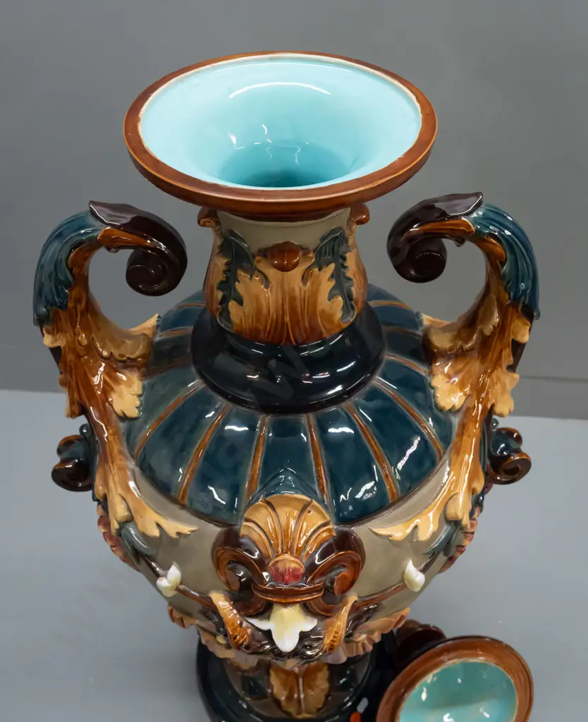 large Wilhelm Schiller & Sons Majolica lidded urn with foliate scrolling handles, acanthus leaf motifs, 2 heads, fluted Image 1++