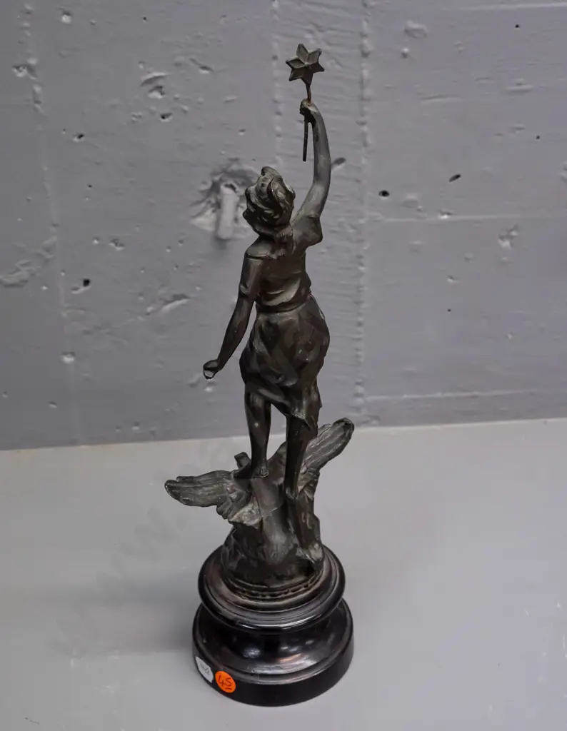 art nouveau maiden figure standing on an eagle holding a star, 'La Nuit'. Rounded wooden base with a plaque. Image 1++