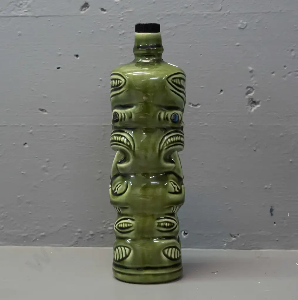 ceramic tiki liqueur bottle with paua eyes, Ti-Toki Auckland label, made in Aotearo impressed on base H-290 Image 1++