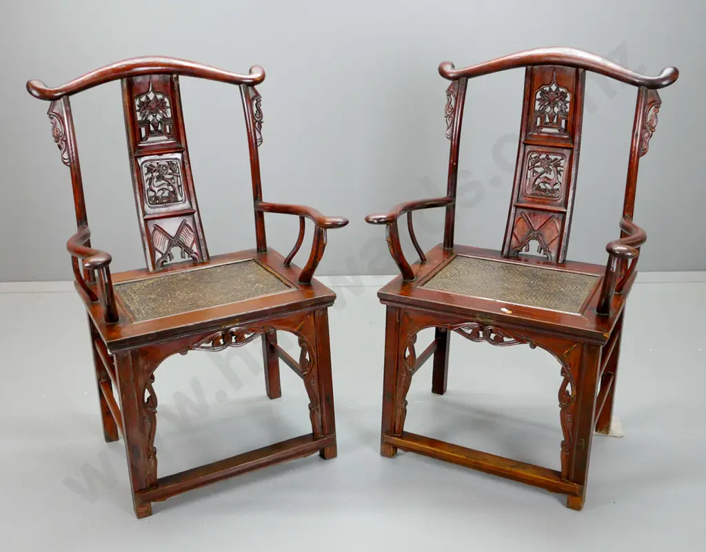 pair of Chinese elm Qing yoke-back chairs with carved back splats with flower and deer motifs, carved front bracket, Image 1++