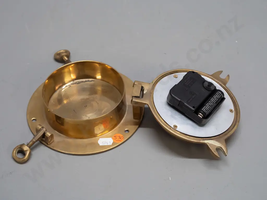small brass porthole style clock with quartz movement - face marked Gorch Fock Hamburg, minor discolouration D-150 Going Image 1++
