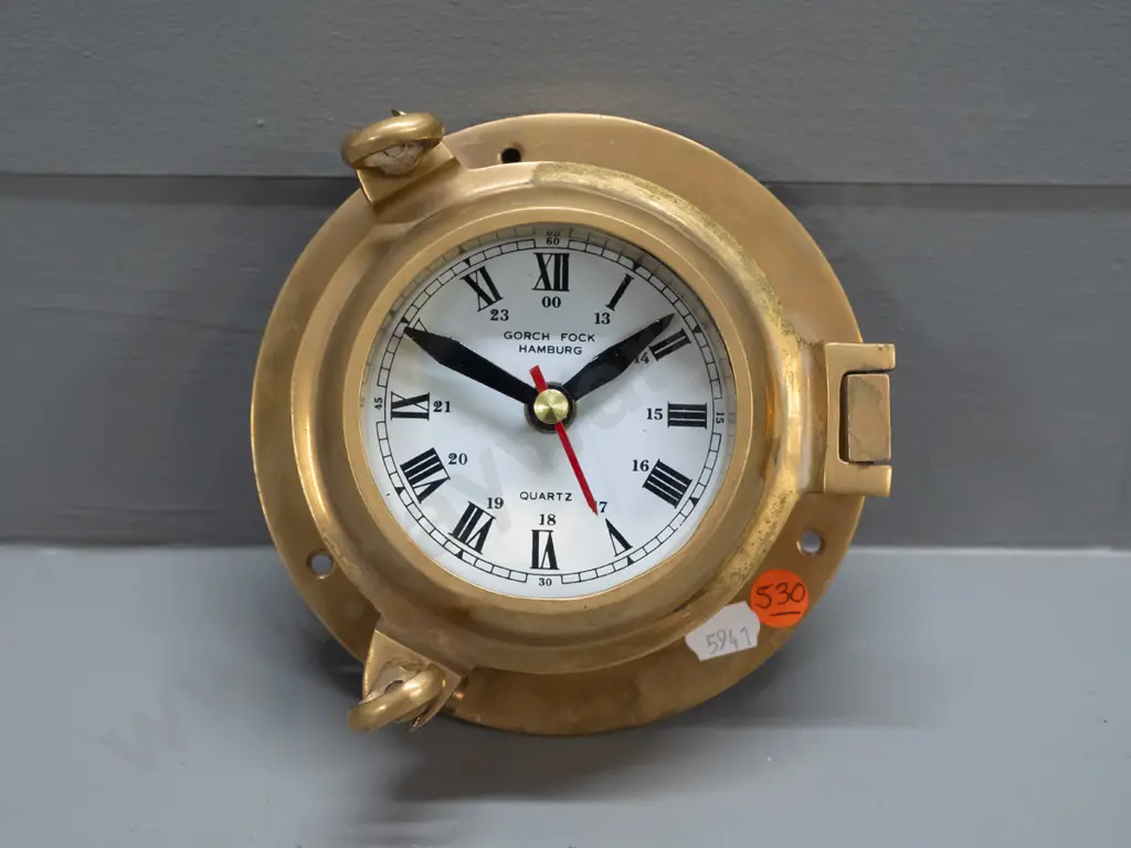 small brass porthole style clock with quartz movement - face marked Gorch Fock Hamburg, minor discolouration D-150 Going Image 1++