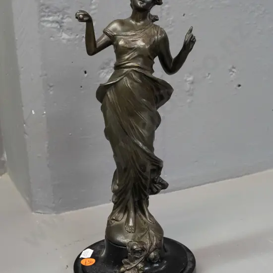 cast metal (spelter?) figure of a woman, on timber base - stand for a mystery clock. Hard to read signature impressed on