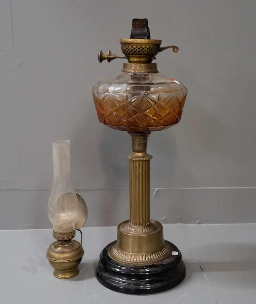 2 vintage kerosene lamps - larger with fluted brass column, cut glass tank with residue, no chimney. Smaller brass lamp Image 1++
