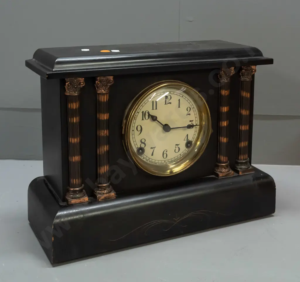 Sessions mantel clock in black finish timber case with applied metal fluted columns, enamel face - bezel hinge is broken Image 1++