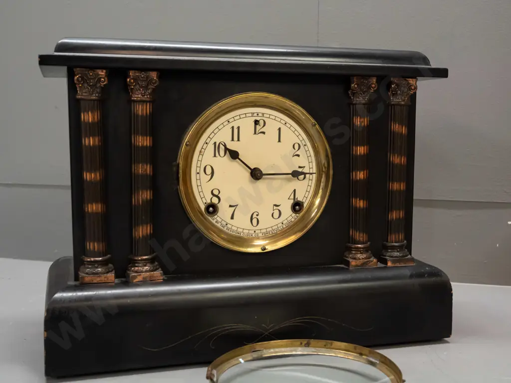 Sessions mantel clock in black finish timber case with applied metal fluted columns, enamel face - bezel hinge is broken Image 1++