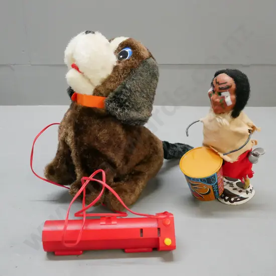 1x battery-powered Japanese vintage acrobat pup; 1x wind-up vintage first nations drummer