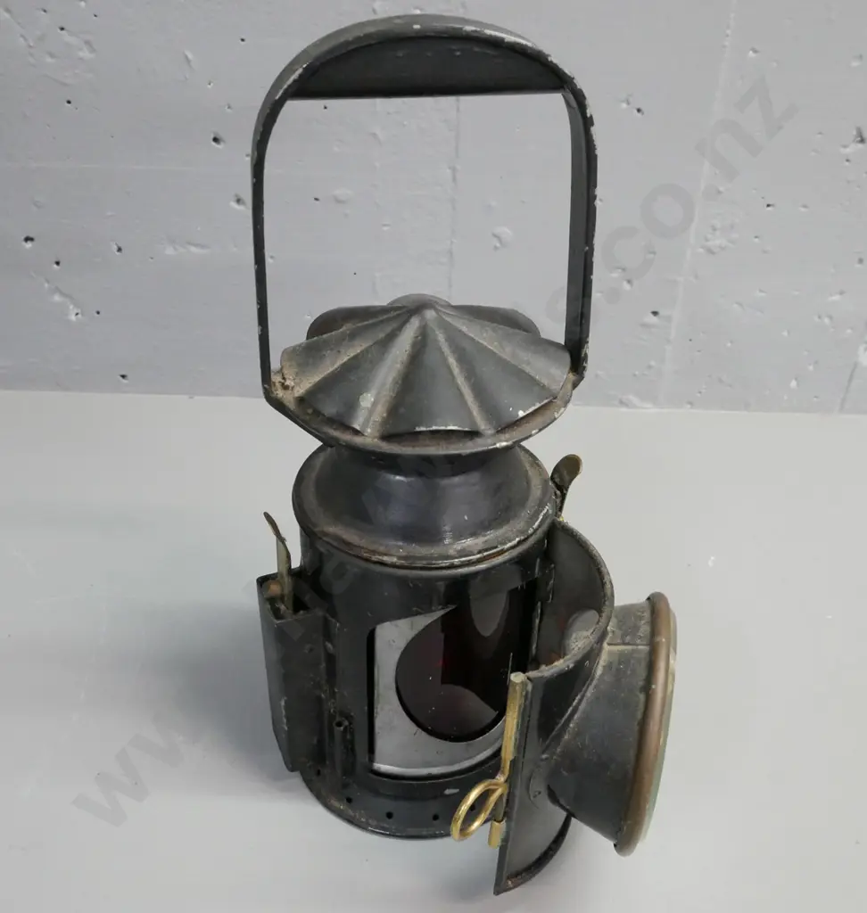vintage brass & metal Lantern. Clear glass bezel outside. Door opens to reveal red glass reflector inside. H-340 D-160 Image 1++