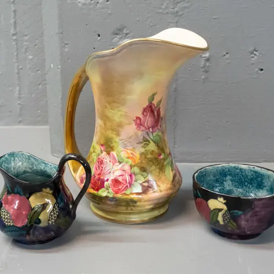 Royal Winton Grimwades gilt & floral jug H-200 and Rubens Ware "Pomegranate" cream & sugar, marked FX Abraham on base.