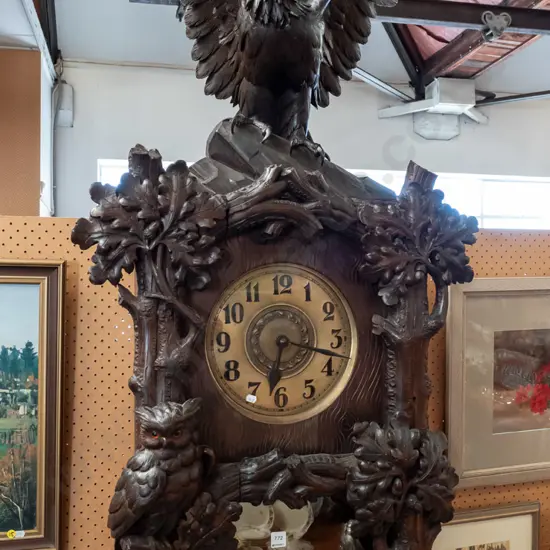 large heavily carved walnut & oak Black Forest long case clock w/ tree branch & leaf motifs, owls and eagle with glass