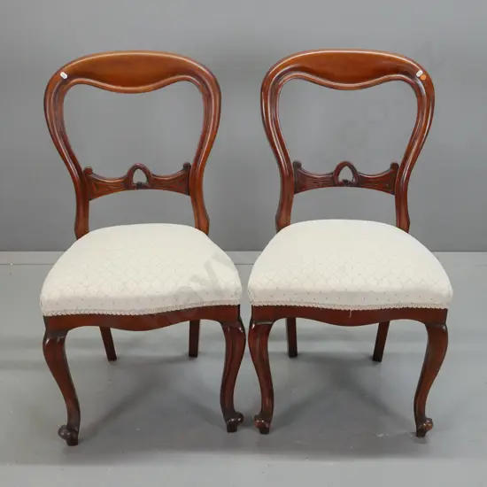 pair of mahogany balloon-back chairs with carved back splat, shaped front w/ scrolling cabriolet legs, ivory diamond
