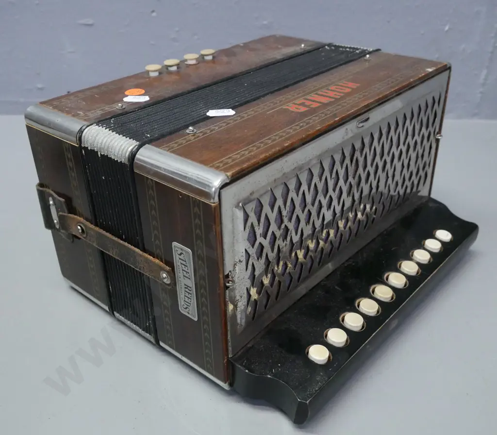vintage Hohner Button Accordion, some evidence of borer, corrosion to corner caps & grille, wear to corners of bellows. Image 1++
