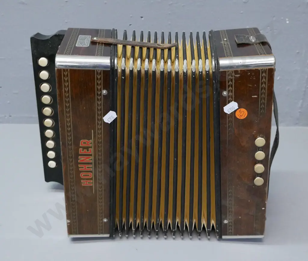 vintage Hohner Button Accordion, some evidence of borer, corrosion to corner caps & grille, wear to corners of bellows. Image 1++