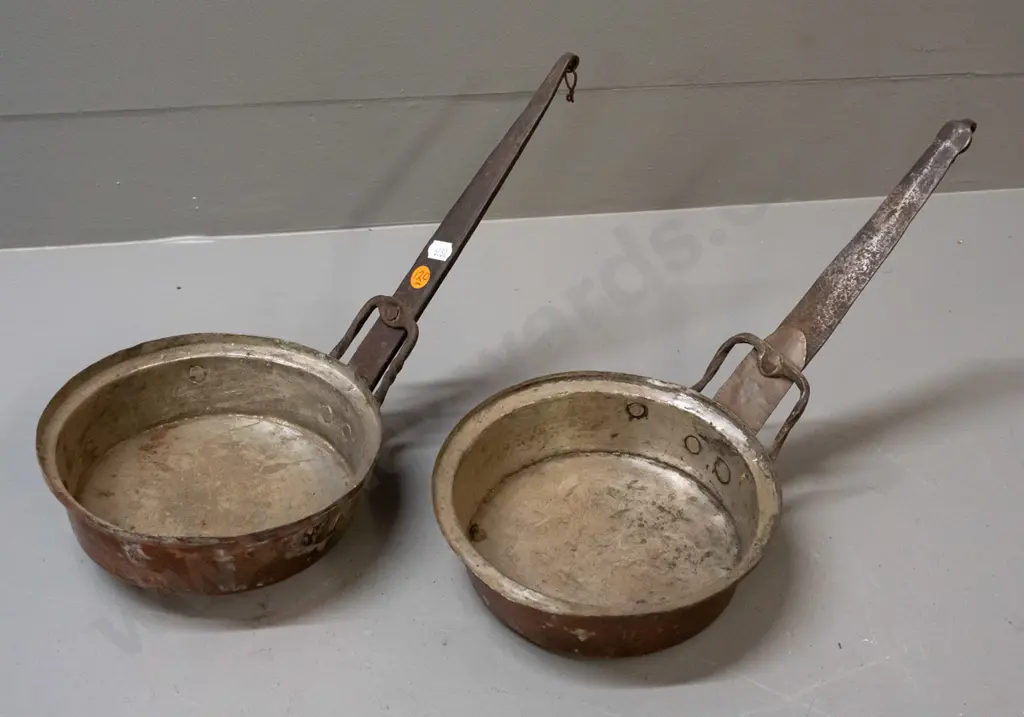 pair of vintage copper-plated saucepans with forged iron handles w/ twisted supports - age wear and denting, both approx Image 1++