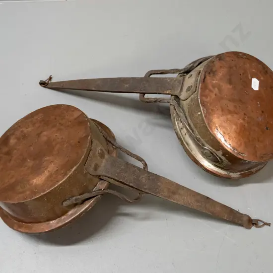 pair of vintage copper-plated saucepans with forged iron handles w/ twisted supports - age wear and denting, both approx