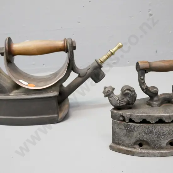2x vintage cast metal irons. 1. Fletcher Russell & Co, Warrington. 2. With rooster latch