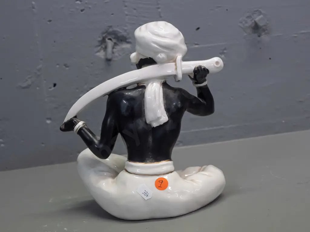 retro porcelain seated genie figure, black and white with gilt and silver, no maker's mark - some rubbing to gilt H-230 Image 1++