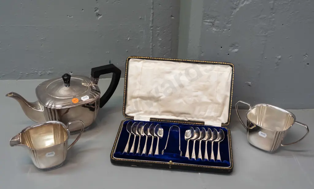 cased set of 12 teaspoons plus sugar-tongs, plated. Art Deco-style plated teapot, sugar and cream jug w/ bakelite handle Image 1++