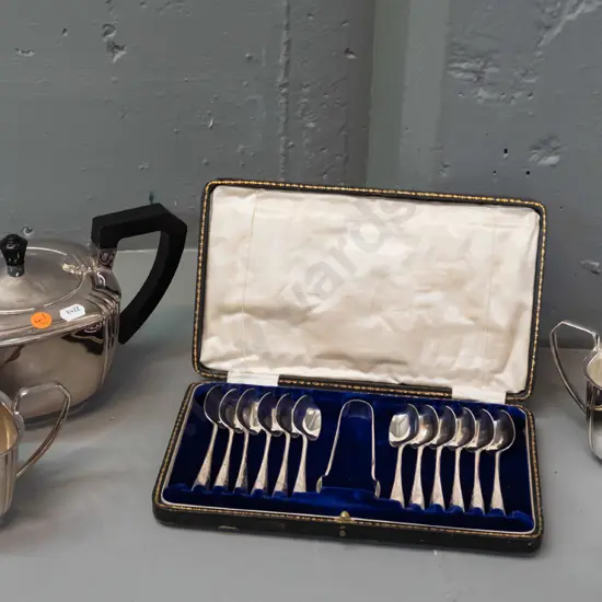 cased set of 12 teaspoons plus sugar-tongs, plated. Art Deco-style plated teapot, sugar and cream jug w/ bakelite handle