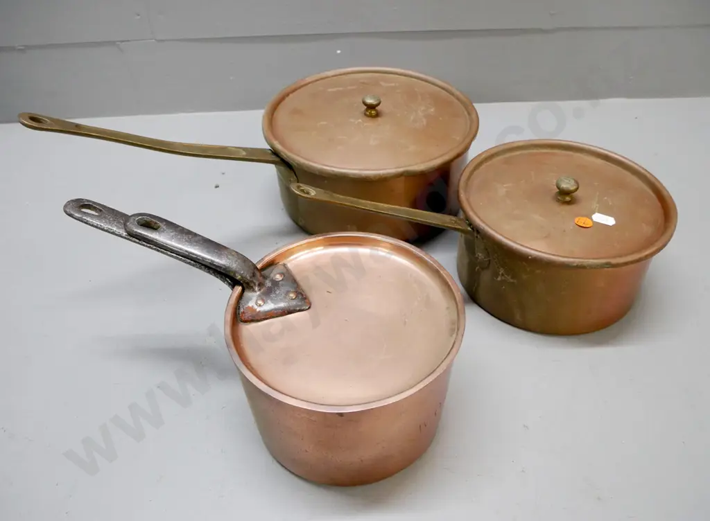 3x vintage saucepans, coppered white metal. Two with brass handles, one with cast handles. Image 1++