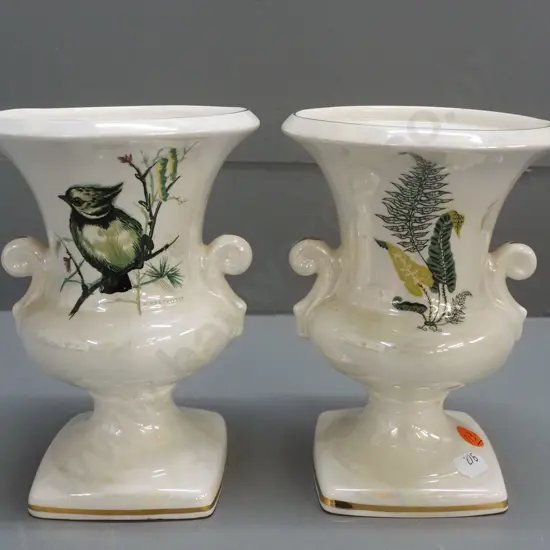 2 small urn-shaped lustre glaze vases with gilded rim, lug handles and base, transfer decoration -