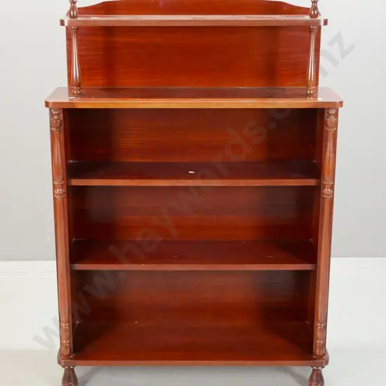 reproduction Victorian style mahogany open-shelf bookcase with turned supports and finials, RA Davies Christchurch label