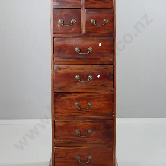 reproduction mahogany 9-drawer tallboy with brass swan-neck handles, on shaped plinth base. Some staining to top. H-1500