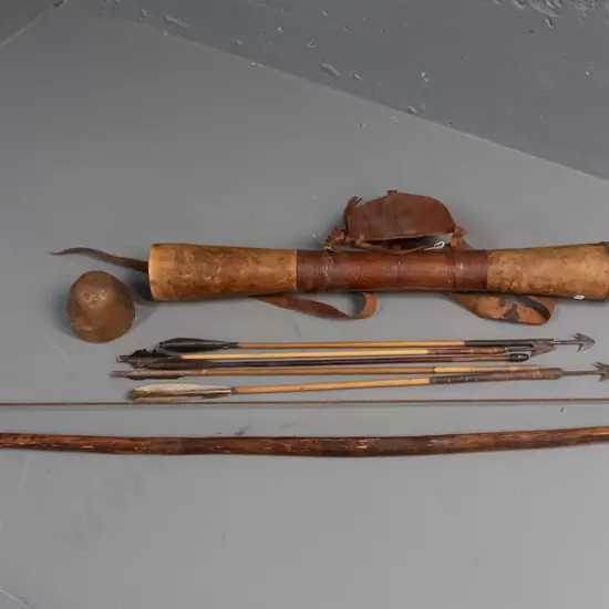 Somali bow, leather quiver with 5 feather-fletched arrows, 3 have steel heads, one missing head, with small embossed