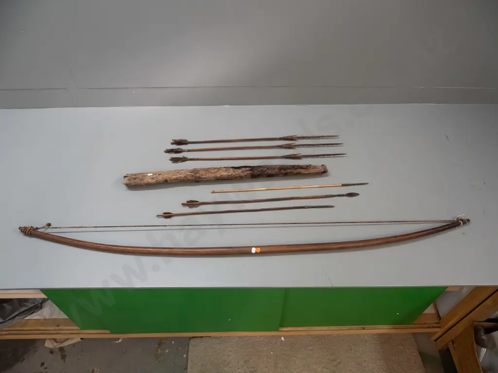 wooden bow and 6 arrows in hide quiver, possibly South Sudan according to note - 3 arrows have steel heads. Quiver is Image 1++